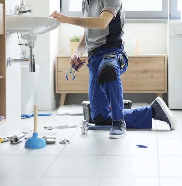 Plumber fixing a bathroom sink